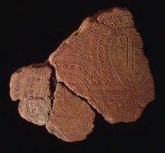 11. Terra cotta fragment 11. Terra cotta fragment