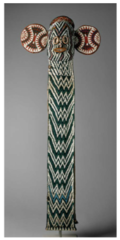 178. Aka elephant mask
Location: Cameroon, western grass fields region
Artist: ?
Date: c. 19th-20th century C.E.
Culture: Bamileke
Period/Style: ...
Medium/Material: Wood, woven raffia, cloth, beads
Theme(s): ritual, honor of elephants, ...
Form: comprise cloth panels and hoods woven from plantain fiber over raffia. On this background multicolored beads are stitched
in geometric patterns.
Function: Maskers dance barefoot in these colorful costumes to a drum and gong, moving slowly as they wave poles with blue and white beaded tips
trimmed with horsehair while whistling 178. Aka elephant mask
Location: Cameroon, western grass fields region
Artist: ?
Date: c. 19th-20th century C.E.
Culture: Bamileke
Period/Style: ...
Medium/Material: Wood, woven raffia, cloth, beads
Theme(s): ritual, honor of elephants, ...
Form: comprise cloth panels and hoods woven from plantain fiber over raffia. On this background multicolored beads are stitched
in geometric patterns.
Function: Maskers dance barefoot in these colorful costumes to a drum and gong, moving slowly as they wave poles with blue and white beaded tips
trimmed with horsehair while whistling