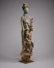 180: Veranda post: equestrian figure and female caryatid
Location: ?
Artist: Olowe of Ise
Date: before 1938 C.E
Culture: Yoruba peoples, Ekiti group
Period/Style: ...
Medium/Material: wood & pigment
Theme(s): marriage importance (first wife), hierarchy of scale
Form: an equestrian warior, is depicted frontally above a female caryatid with arms raised in three-quarter view; first wife is larger than other 2
Function: designed for the exterior courtyard of a Yoruba palace
Content: mounted warrior holds a spear and pistol in either hand, and his vest, saddle, and horse's headgear are articulated through deeply carved linear motifs
Context: In Yoruba art such equestrian figures identify their patrons with martial conquest achieved through physical might.
Cross Cultural Connection(s): 180: Veranda post: equestrian figure and female caryatid
Location: ?
Artist: Olowe of Ise
Date: before 1938 C.E
Culture: Yoruba peoples, Ekiti group
Period/Style: ...
Medium/Material: wood & pigment
Theme(s): marriage importance (first wife), hierarchy of scale
Form: an equestrian warior, is depicted frontally above a female caryatid with arms raised in three-quarter view; first wife is larger than other 2
Function: designed for the exterior courtyard of a Yoruba palace
Content: mounted warrior holds a spear and pistol in either hand, and his vest, saddle, and horse's headgear are articulated through deeply carved linear motifs
Context: In Yoruba art such equestrian figures identify their patrons with martial conquest achieved through physical might.
Cross Cultural Connection(s):