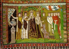 51c. Theodora and Attendants
Location: San Vitale; Ravenna, Italy
Date: c. 547 C.E.
Period/Style: Early Byzantine
Medium/Material: mosaic
Theme(s): authority and unity between state and church, similarly to Justinian and Attendants
Form: displacement of absolute symmetry with Theodora (play a secondary role to her husband)
Function: depicts Theodora and her attendants participating in the Mass
Content: Richly robed empress and ladies at court, stands in an architectural framework, holding a chalice for the mass, and is about to go behind the curtain, flattened and weightless
Context: Three Magi, who bring gifts to the baby Jesus, are depicted in the hem of her dress, referring to a parallel between Theodora and the Magi
Cross Cultural Connection(s): Dome of the Rock interior 51c. Theodora and Attendants
Location: San Vitale; Ravenna, Italy
Date: c. 547 C.E.
Period/Style: Early Byzantine
Medium/Material: mosaic
Theme(s): authority and unity between state and church, similarly to Justinian and Attendants
Form: displacement of absolute symmetry with Theodora (play a secondary role to her husband)
Function: depicts Theodora and her attendants participating in the Mass
Content: Richly robed empress and ladies at court, stands in an architectural framework, holding a chalice for the mass, and is about to go behind the curtain, flattened and weightless
Context: Three Magi, who bring gifts to the baby Jesus, are depicted in the hem of her dress, referring to a parallel between Theodora and the Magi
Cross Cultural Connection(s): Dome of the Rock interior