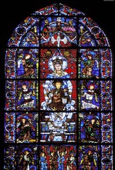 Chartres Cathedral Notre Dame de la Belle Verriere Window
Mary crowned as Queen of Heaven with Christ child on her lap
Light as a manifestation of the divine, shades color patterns across the grey stone of the cathedral
Part of a lancet window
Undamaged by the fire of 1194, reset with framing angles on either side of the main scene after reconstruction
Bar tracery as bars go across the window to provide support Chartres Cathedral Notre Dame de la Belle Verriere Window
Mary crowned as Queen of Heaven with Christ child on her lap
Light as a manifestation of the divine, shades color patterns across the grey stone of the cathedral
Part of a lancet window
Undamaged by the fire of 1194, reset with framing angles on either side of the main scene after reconstruction
Bar tracery as bars go across the window to provide support