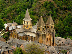 Church of Sainte Foy Exterior
Conques, France, Romanesque, 1050-1130, stone
Church built along the pilgrimage site to the Santiago de Compostela
Church built to handle large number of people coming to view the relics housed there, has wide transept, large ambulatory and many radiating chapels
Massive heavy unornamented interior walls
No clerestory as barrel vaults were too heavy and required too much butressing so no room, but light provided by windows over side aisles and galleries
Barrel vaults fill the nave, reinforced by various transverse arches
Cross like ground plan Church of Sainte Foy Exterior
Conques, France, Romanesque, 1050-1130, stone
Church built along the pilgrimage site to the Santiago de Compostela
Church built to handle large number of people coming to view the relics housed there, has wide transept, large ambulatory and many radiating chapels
Massive heavy unornamented interior walls
No clerestory as barrel vaults were too heavy and required too much butressing so no room, but light provided by windows over side aisles and galleries
Barrel vaults fill the nave, reinforced by various transverse arches
Cross like ground plan