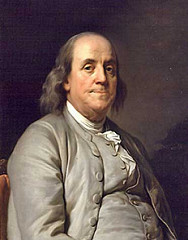 During the American Revolution, Benjamin Franklin played an important diplomatic role by: