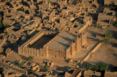 Great Mosque of Djenne
Mali, 1200, Rebuilt in 1906/1907
Three tall towers, central one is a mihrab
Crowning ornaments have ostrich eggs, symbols of fertility and purity
Has many torons, wood beams sticking out from wall
Made of adobe, a baked mixture of clay/straw
Torons act as ladders for maintenance of the building
Vertical fluting drains water of surfaces quickly
Largest mud brick mosque in the world Great Mosque of Djenne
Mali, 1200, Rebuilt in 1906/1907
Three tall towers, central one is a mihrab
Crowning ornaments have ostrich eggs, symbols of fertility and purity
Has many torons, wood beams sticking out from wall
Made of adobe, a baked mixture of clay/straw
Torons act as ladders for maintenance of the building
Vertical fluting drains water of surfaces quickly
Largest mud brick mosque in the world