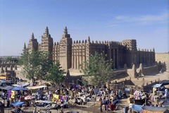 Great Mosque of Djenné
Mali. Founded c. 1200 C.E.; rebuilt 1906-1907. Adobe.
As one of the wonders of Africa, and one of the most unique religious buildings in the world, the Great Mosque of Djenné, in present-day Mali, is also the greatest achievement of Sudano-Sahelian architecture. It is also the largest mud-built structure in the world. We experience its monumentality from afar as it dwarfs the city of Djenné. Great Mosque of Djenné
Mali. Founded c. 1200 C.E.; rebuilt 1906-1907. Adobe.
As one of the wonders of Africa, and one of the most unique religious buildings in the world, the Great Mosque of Djenné, in present-day Mali, is also the greatest achievement of Sudano-Sahelian architecture. It is also the largest mud-built structure in the world. We experience its monumentality from afar as it dwarfs the city of Djenné.