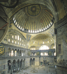 Hagia Sophia Interior
Constantinople Anthemius of Tralles and Isidorus of Miletus 523-537 C.E., Brick/Ceramic elements with stone and mosaic veneer
Commisioned by Justinian showing his power after the Nike Revolt of 532
Combo of centrally planned church and axial planned basilican church
Exterior is plan yet massive
Central dome made with no supports beneath it done by using pendentives supported by large piers
Half domes to each side of the main dome helps spread out the weight
40 windows placed at bottom of domes making it seem like they are floating
Large gold mosaics once covered the walls
Marble brought from across the empire
Minarets added during the islamic period when building made into a mosque Hagia Sophia Interior
Constantinople Anthemius of Tralles and Isidorus of Miletus 523-537 C.E., Brick/Ceramic elements with stone and mosaic veneer
Commisioned by Justinian showing his power after the Nike Revolt of 532
Combo of centrally planned church and axial planned basilican church
Exterior is plan yet massive
Central dome made with no supports beneath it done by using pendentives supported by large piers
Half domes to each side of the main dome helps spread out the weight
40 windows placed at bottom of domes making it seem like they are floating
Large gold mosaics once covered the walls
Marble brought from across the empire
Minarets added during the islamic period when building made into a mosque