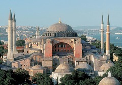 Hagia Sophia
Constantinople Anthemius of Tralles and Isidorus of Miletus 523-537 C.E., Brick/Ceramic elements with stone and mosaic veneer
Commisioned by Justinian showing his power after the Nike Revolt of 532
Combo of centrally planned church and axial planned basilican church
Exterior is plan yet massive
Central dome made with no supports beneath it done by using pendentives supported by large piers
Half domes to each side of the main dome helps spread out the weight
40 windows placed at bottom of domes making it seem like they are floating
Large gold mosaics once covered the walls
Marble brought from across the empire
Minarets added during the islamic period when building made into a mosque Hagia Sophia
Constantinople Anthemius of Tralles and Isidorus of Miletus 523-537 C.E., Brick/Ceramic elements with stone and mosaic veneer
Commisioned by Justinian showing his power after the Nike Revolt of 532
Combo of centrally planned church and axial planned basilican church
Exterior is plan yet massive
Central dome made with no supports beneath it done by using pendentives supported by large piers
Half domes to each side of the main dome helps spread out the weight
40 windows placed at bottom of domes making it seem like they are floating
Large gold mosaics once covered the walls
Marble brought from across the empire
Minarets added during the islamic period when building made into a mosque