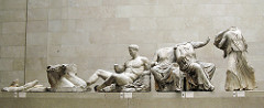 Helios, Horses, and Dionysus on the Acropolis
Sculpture on east Pediment of the Parthenon, classical period
Central portion which no longer survives depicts the birth of Athena from the head of Zeus
Figures are relaxed yet sense of nobility and god status present
Sculpture have classical depiction with flowing drapery revealing the from of their bodies
Figures heighten as they get towards the middle because in triangular space Helios, Horses, and Dionysus on the Acropolis
Sculpture on east Pediment of the Parthenon, classical period
Central portion which no longer survives depicts the birth of Athena from the head of Zeus
Figures are relaxed yet sense of nobility and god status present
Sculpture have classical depiction with flowing drapery revealing the from of their bodies
Figures heighten as they get towards the middle because in triangular space
