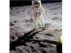 It shows a person standing on the most distant world ever visited by a human being. It shows a person standing on the most distant world ever visited by a human being.