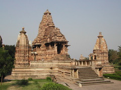 Lakshmana Temple
Khajuraho, India. Hindu, Chandella Dynasty. c. 930-950 C.E. Sandstone
Though the temple is one of the oldest in the Khajuraho fields, it is also one of the most exquistely decorated, covered almost completely with images of over 600 gods in the Hindu Pantheon. The main shrine of the temple, which faces east, is flanked by four freestanding subsidiary shrines at the corners of the temple platform. Lakshmana Temple
Khajuraho, India. Hindu, Chandella Dynasty. c. 930-950 C.E. Sandstone
Though the temple is one of the oldest in the Khajuraho fields, it is also one of the most exquistely decorated, covered almost completely with images of over 600 gods in the Hindu Pantheon. The main shrine of the temple, which faces east, is flanked by four freestanding subsidiary shrines at the corners of the temple platform.