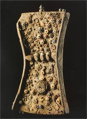 Lukasa
Mbudye Society, Congo, 19-20th century, wood/beads/metal
Memory board used to help user remember key moments in ones life such as: court cases, migrations, heroes, kinship, list of kings
Carved from wood in hourglass shape, adorned with shells/beads/metal
Reader holds lukasa in left hand and traces design with right index finger
Ability to read board limited to few people
Backs resembles a tortoise
Each boards design is unique and represents the divine revelations of a spirit medium expresed in sculptural form
Memory boards controlled by a council of men/women (Mbudye) who interpret events that have occurred thus far in ones life
Zoomorphic elements like crocodile living on land/water, society at time had two rulers Lukasa
Mbudye Society, Congo, 19-20th century, wood/beads/metal
Memory board used to help user remember key moments in ones life such as: court cases, migrations, heroes, kinship, list of kings
Carved from wood in hourglass shape, adorned with shells/beads/metal
Reader holds lukasa in left hand and traces design with right index finger
Ability to read board limited to few people
Backs resembles a tortoise
Each boards design is unique and represents the divine revelations of a spirit medium expresed in sculptural form
Memory boards controlled by a council of men/women (Mbudye) who interpret events that have occurred thus far in ones life
Zoomorphic elements like crocodile living on land/water, society at time had two rulers