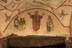 Orant Figure:
Fresco above a tomb niche on an arched wall
Stands with arms out in prayer, figure is dark and compact against the light background
Left shows teacher with children
Right shows mother and child referring to Mary and Jesus Orant Figure:
Fresco above a tomb niche on an arched wall
Stands with arms out in prayer, figure is dark and compact against the light background
Left shows teacher with children
Right shows mother and child referring to Mary and Jesus