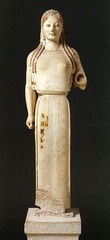 Peplos Kore from Acropolis
Archaic Greek 530 B.C.E., marble
Found on the acropolis, female equivalent of a kouros
Kore usually an offering to the goddess Athena, but possibly a representation of a goddess
Unusual clothing similar to that of a goddess
Left hand possibly used to hold a weapon such as a bow signifying she was Artemis
Right hand is clenched around a possible arrow no longer there anymore possibly artemis
Archaic smile present
Very feminie with protruding breasts and a narrow waist
Naturalistic representation with hair falling naturally on her body Peplos Kore from Acropolis
Archaic Greek 530 B.C.E., marble
Found on the acropolis, female equivalent of a kouros
Kore usually an offering to the goddess Athena, but possibly a representation of a goddess
Unusual clothing similar to that of a goddess
Left hand possibly used to hold a weapon such as a bow signifying she was Artemis
Right hand is clenched around a possible arrow no longer there anymore possibly artemis
Archaic smile present
Very feminie with protruding breasts and a narrow waist
Naturalistic representation with hair falling naturally on her body