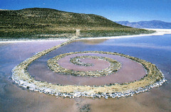 Spiral Jetty
Great Salt Lake, Utah. U.S. Robert Smithson. 1970 C.E. Earthwork: mud, precipitated salt crystals, rocks, and water coil
The wind alters the intensity of the water's changing colors, as does the quality of the light and the density of the overhead cloud-cover. As you start to walk the spiral, you enter a kaleidoscope of moaning wind, relentless light, and mercurial water colors. Spiral Jetty
Great Salt Lake, Utah. U.S. Robert Smithson. 1970 C.E. Earthwork: mud, precipitated salt crystals, rocks, and water coil
The wind alters the intensity of the water's changing colors, as does the quality of the light and the density of the overhead cloud-cover. As you start to walk the spiral, you enter a kaleidoscope of moaning wind, relentless light, and mercurial water colors.