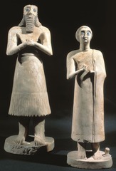 Statue of Votive figures from the Square Temple at Eshnunna
Sumerian. c. 2700 B.C.E. Gypsum inland with shell and black limestone
Surrogate for donor and offers constant prayer to deities. Placed in the Temple facing altar of the state gods Statue of Votive figures from the Square Temple at Eshnunna
Sumerian. c. 2700 B.C.E. Gypsum inland with shell and black limestone
Surrogate for donor and offers constant prayer to deities. Placed in the Temple facing altar of the state gods
