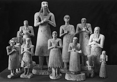 Statues o votive figures, from the Square Temple at Eshnunna. Sumerian. c. 2700 bce. Gypsum inlaid with shell and black limestone Statues o votive figures, from the Square Temple at Eshnunna. Sumerian. c. 2700 bce. Gypsum inlaid with shell and black limestone