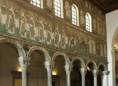 *Title:* Basilica of Sant'apollinare Nuovo
*Artist:*
*Period/Style:* Byzantine
*Date:* 526 CE
*Patron:*
*Original Location:* Ravenna, Italy
*Material:*
*Subject:* Church featuring murals depicting procession and emporeror
*Technique and Description:*
-mosaic (with shading)
-axial plan
*Context:*
-Christianity asserts itself as a powerful religion and associates with Byzantine power structure
-inspired by Roman art but make new styles
-priests continue preaching humility while dressed as emperors (hypocritical)
-visualize Jesus as emperor, Lord in Heaven and a lord on earth
-Byzantine steps into Roman Empire which dissolves in west and changes in east (keep power structure)
-try to preach in a way that kept lower class from questioning authority
-Byzantine emperor makes himself head of church (funds art)
-religious art becomes an act of anonymous devotion, took very seriously b/c people took notes on mistakes and it influenced afterlife
-symbolism becomes more important than realism (naturalism can distract form meaning)
*Message/Meaning:*
MOSAIC:
-Jesus dressed like an emperor, enthroned, feet don't touch the floor, bearded (wiser)
-holding candle to signify Holy Spirit
-ground implies heavenly garden, gold background is heavenly/timeless/spiritual *Title:* Basilica of Sant'apollinare Nuovo
*Artist:*
*Period/Style:* Byzantine
*Date:* 526 CE
*Patron:*
*Original Location:* Ravenna, Italy
*Material:*
*Subject:* Church featuring murals depicting procession and emporeror
*Technique and Description:*
-mosaic (with shading)
-axial plan
*Context:*
-Christianity asserts itself as a powerful religion and associates with Byzantine power structure
-inspired by Roman art but make new styles
-priests continue preaching humility while dressed as emperors (hypocritical)
-visualize Jesus as emperor, Lord in Heaven and a lord on earth
-Byzantine steps into Roman Empire which dissolves in west and changes in east (keep power structure)
-try to preach in a way that kept lower class from questioning authority
-Byzantine emperor makes himself head of church (funds art)
-religious art becomes an act of anonymous devotion, took very seriously b/c people took notes on mistakes and it influenced afterlife
-symbolism becomes more important than realism (naturalism can distract form meaning)
*Message/Meaning:*
MOSAIC:
-Jesus dressed like an emperor, enthroned, feet don't touch the floor, bearded (wiser)
-holding candle to signify Holy Spirit
-ground implies heavenly garden, gold background is heavenly/timeless/spiritual