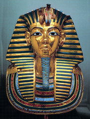 Tutankhamun's Tomb, intermost coffin. New Kingdom, 18th Dynasty. c. 1,323 B.C.E. Gold with inlay of enamel and semiprecious stones.
The kings gold inner coffin, shown above, displays a quality of workmanship and an attention to detail which is unsurpassed. It is a stunning example of the Ancient goldsmith's art Tutankhamun's Tomb, intermost coffin. New Kingdom, 18th Dynasty. c. 1,323 B.C.E. Gold with inlay of enamel and semiprecious stones.
The kings gold inner coffin, shown above, displays a quality of workmanship and an attention to detail which is unsurpassed. It is a stunning example of the Ancient goldsmith's art